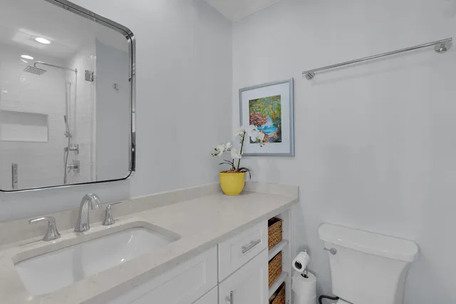 a living room with furniture and a toilet