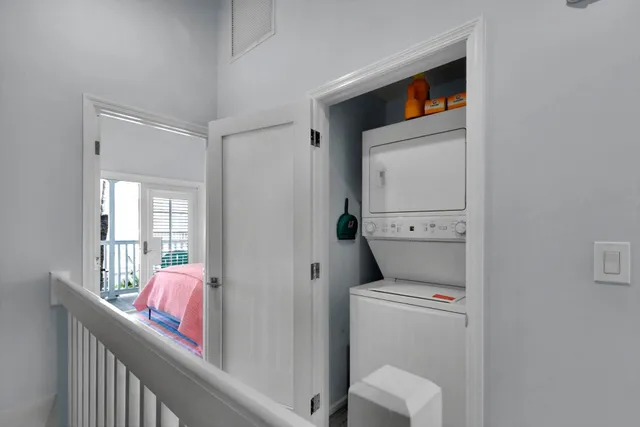 a view of a patio with table and chairs potted plants