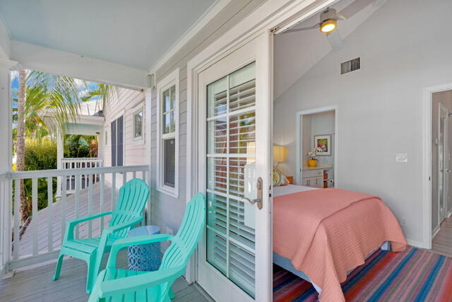 528 Porter Lane Key West, FL 33040 - Photo 18 of 27 a bedroom with a bed and a chair