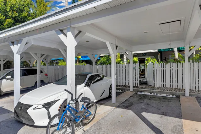 a view of a house with brick walls and flower plants