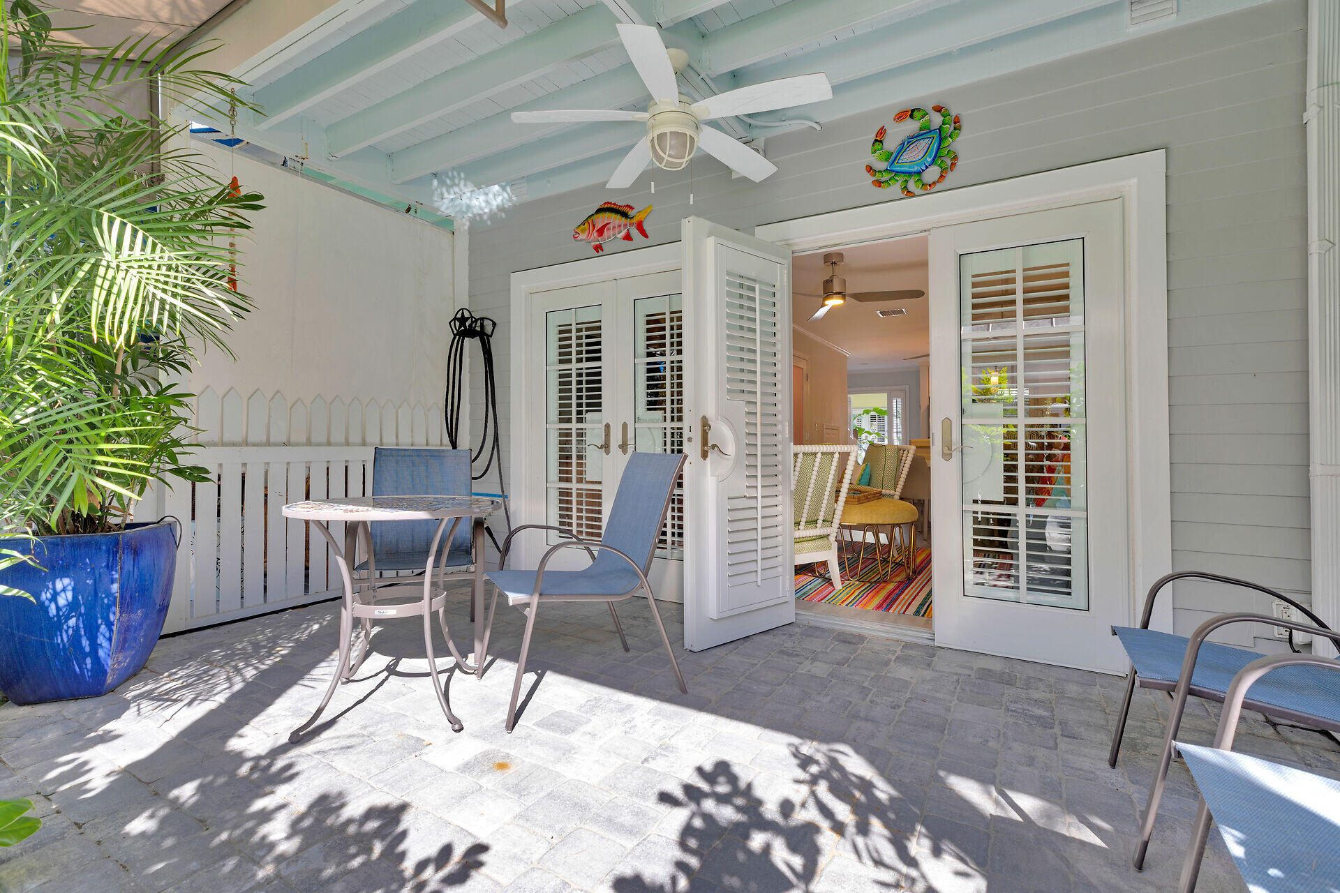 528 Porter Lane Key West, FL 33040 - Photo 22 of 27 a view of a patio with a table and chairs