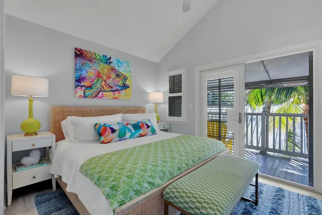 a bedroom with a bed and cupboard