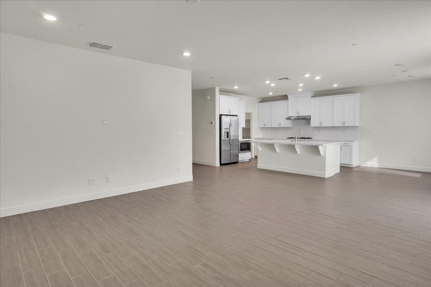 5280 Fandango Loop Roseville, CA 95747 - Photo 4 of 53 Open family room to kitchen. See Staging of same room Virtually staged