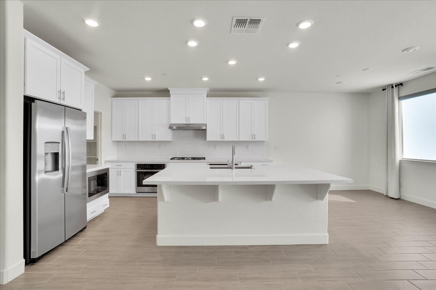 5280 Fandango Loop Roseville, CA 95747 - Photo 8 of 53 Deep sink on large kitchen Island. See virtually staging