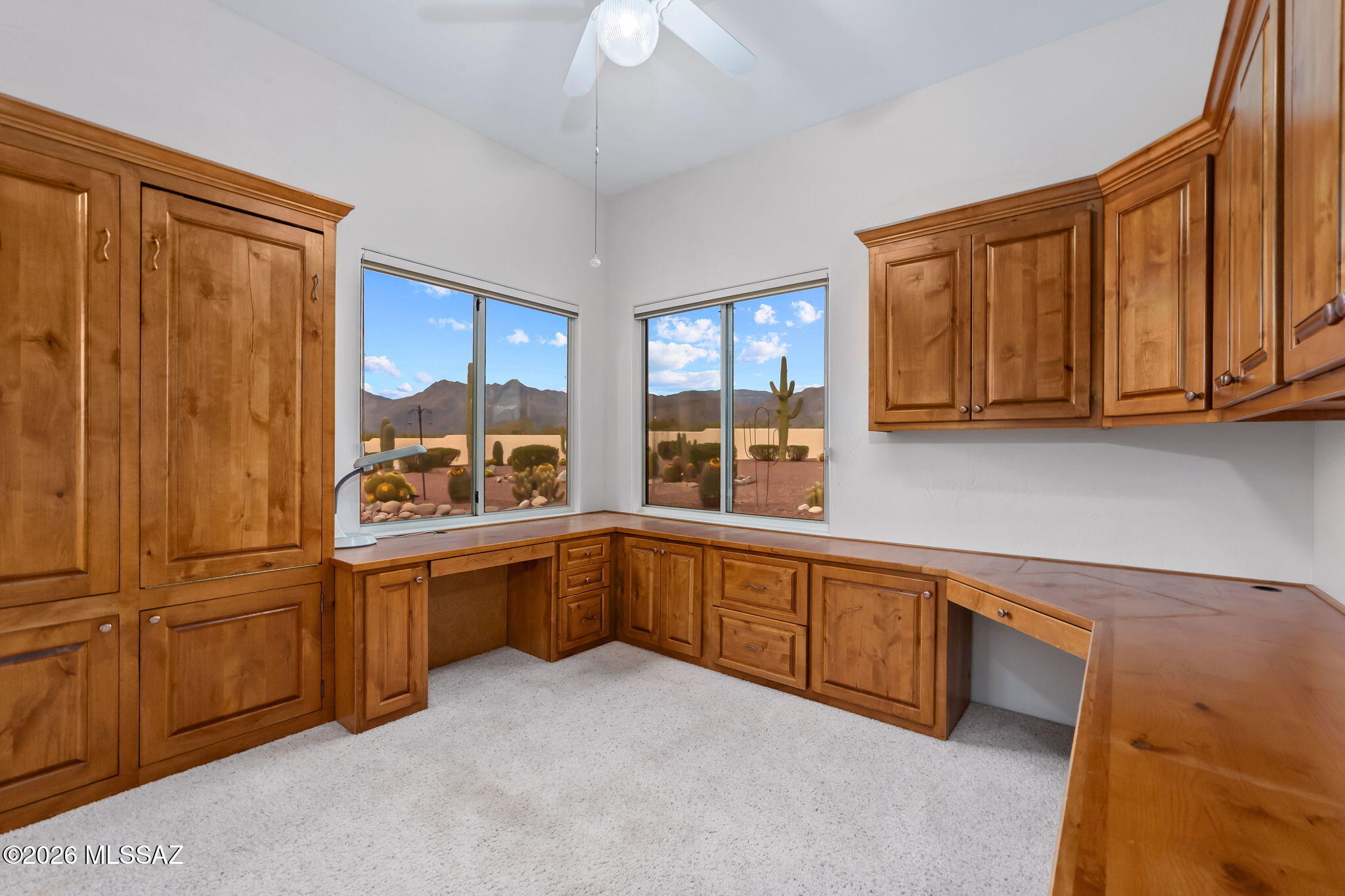 3655 North Harrison Road Tucson, AZ 85749 - Photo 32 of 51 a kitchen with sink cabinets and window
