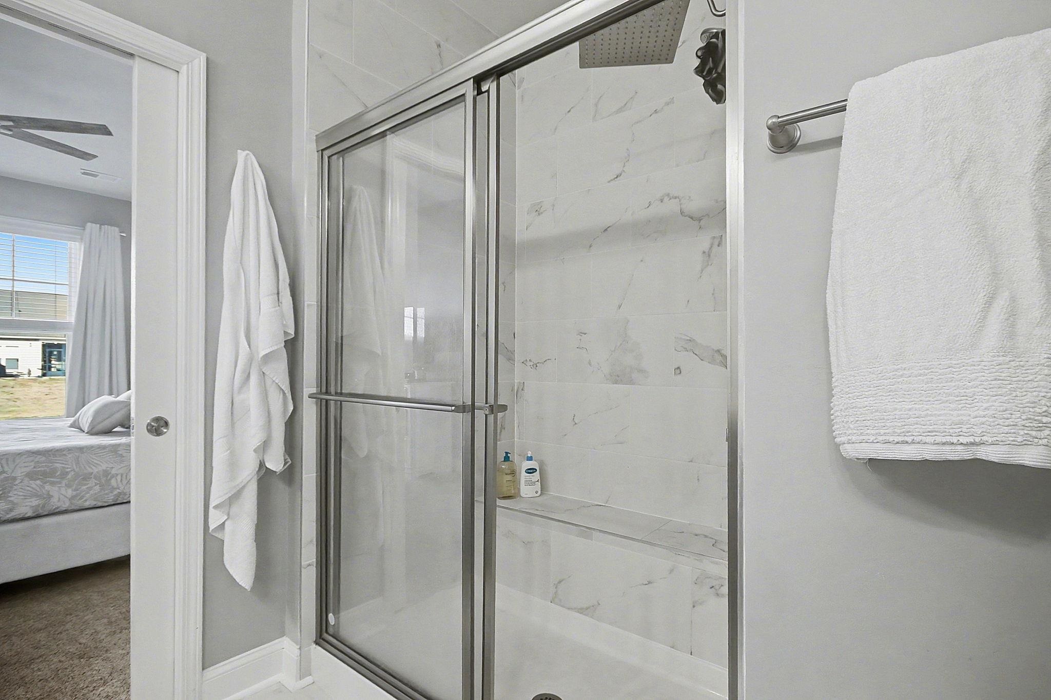 5830 Cremona Drive Myrtle Beach, SC 29577 - Photo 22 of 39 Ensuite bathroom featuring a marble finish shower and ceiling fan