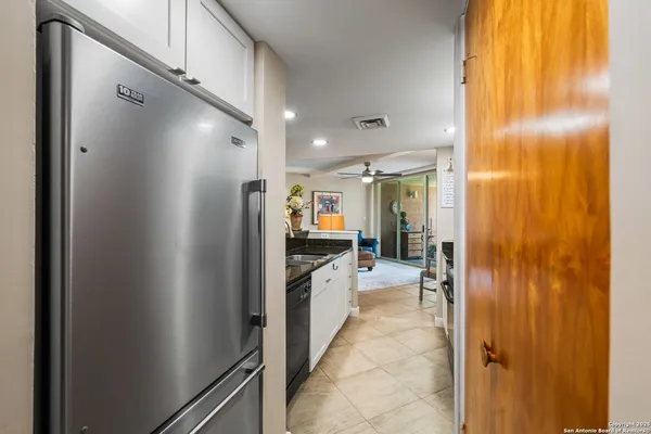 a bathroom with a glass shower door and a glass door