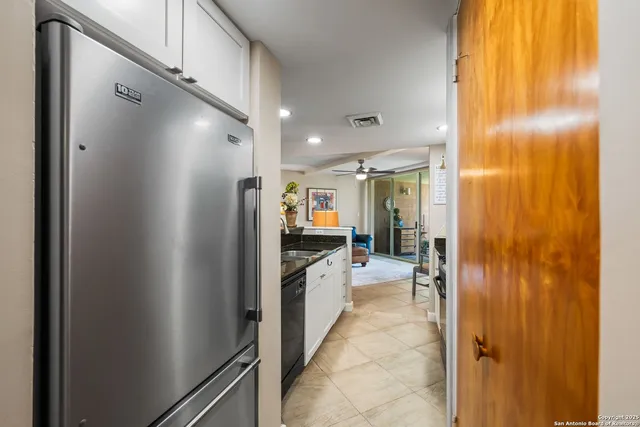 a bathroom with a glass shower door and a glass door