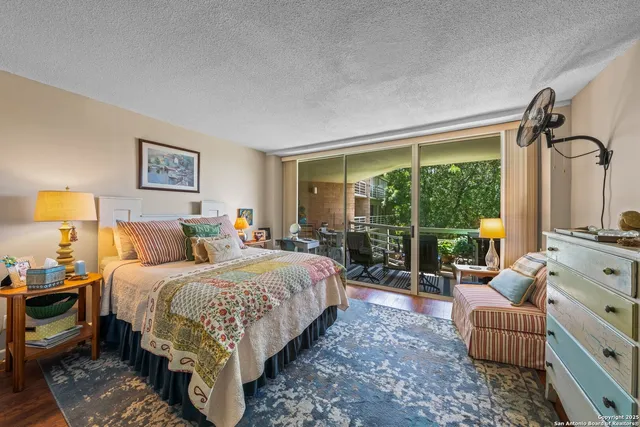 a bedroom with a bed and a couch