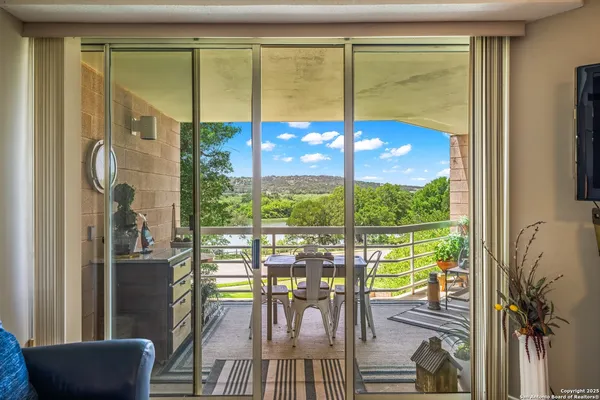 a view of a living room with furniture window and outside view