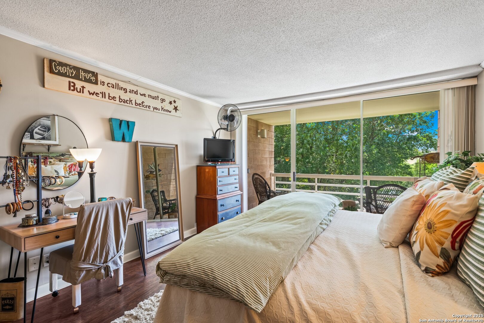 1000 Guadalupe Street, Unit 3B G1 Kerrville, TX 78028 - Photo 21 of 39 a bedroom with a bed and a large window