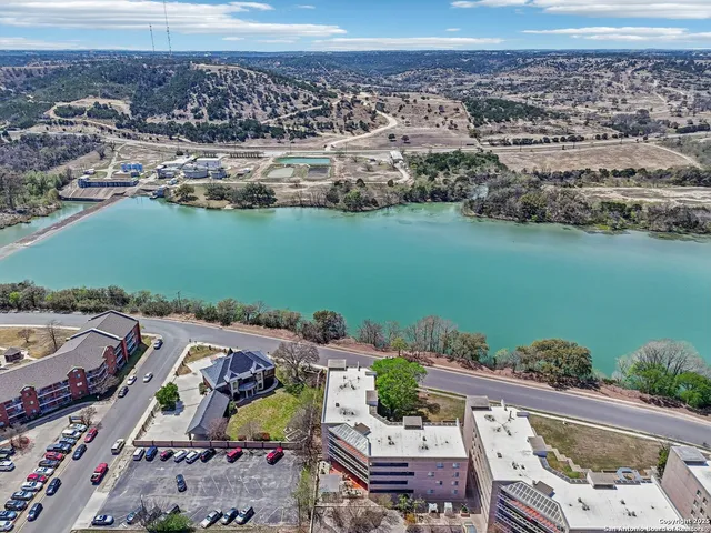 an aerial view of a house with a ocean view