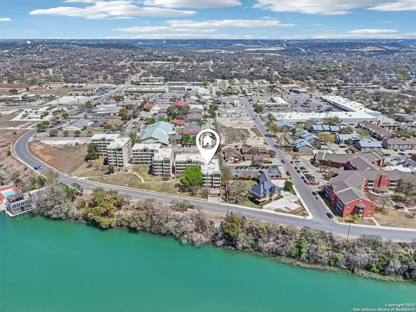 an aerial view of a house with outdoor space