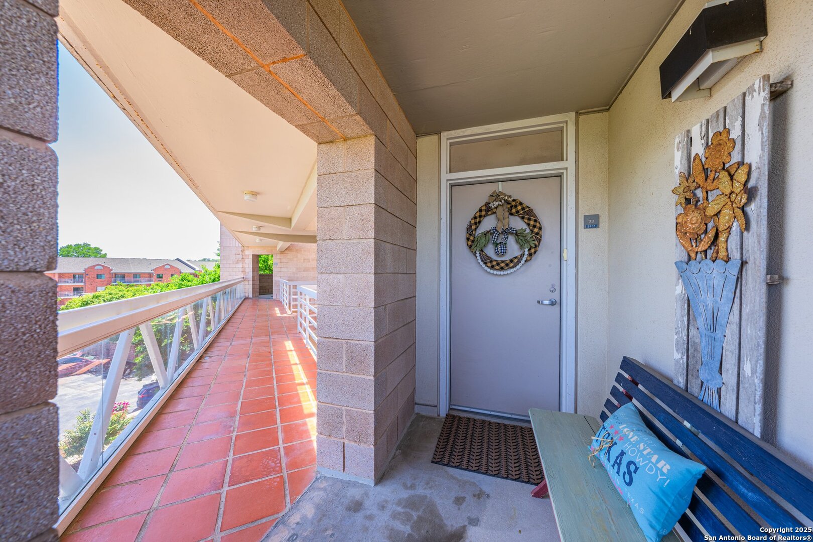 1000 Guadalupe Street, Unit 3B G1 Kerrville, TX 78028 - Photo 10 of 39 a hallway with painting on the wall and a large mirror