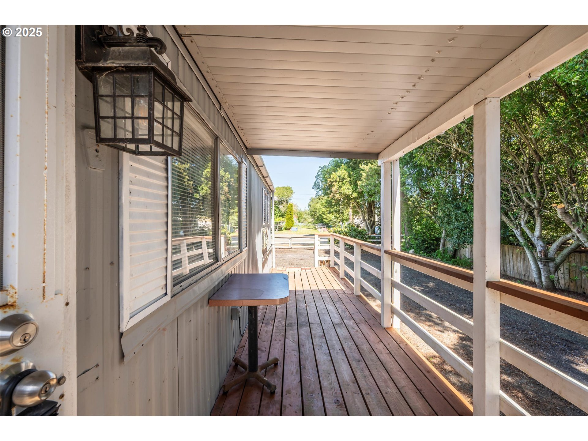 125 North 4th Street Lakeside, OR 97449 - Photo 9 of 38 a view of balcony with wooden floor and outdoor space