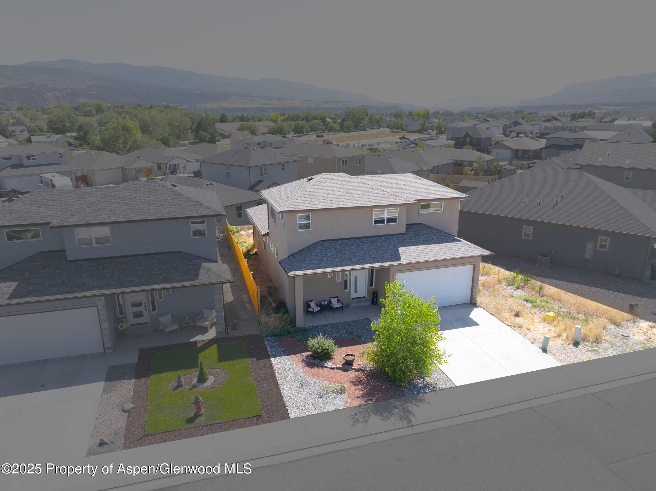 1149 East 17th Street Rifle, CO 81650 - Photo 14 of 16 an aerial view of a house with garden space and ocean view