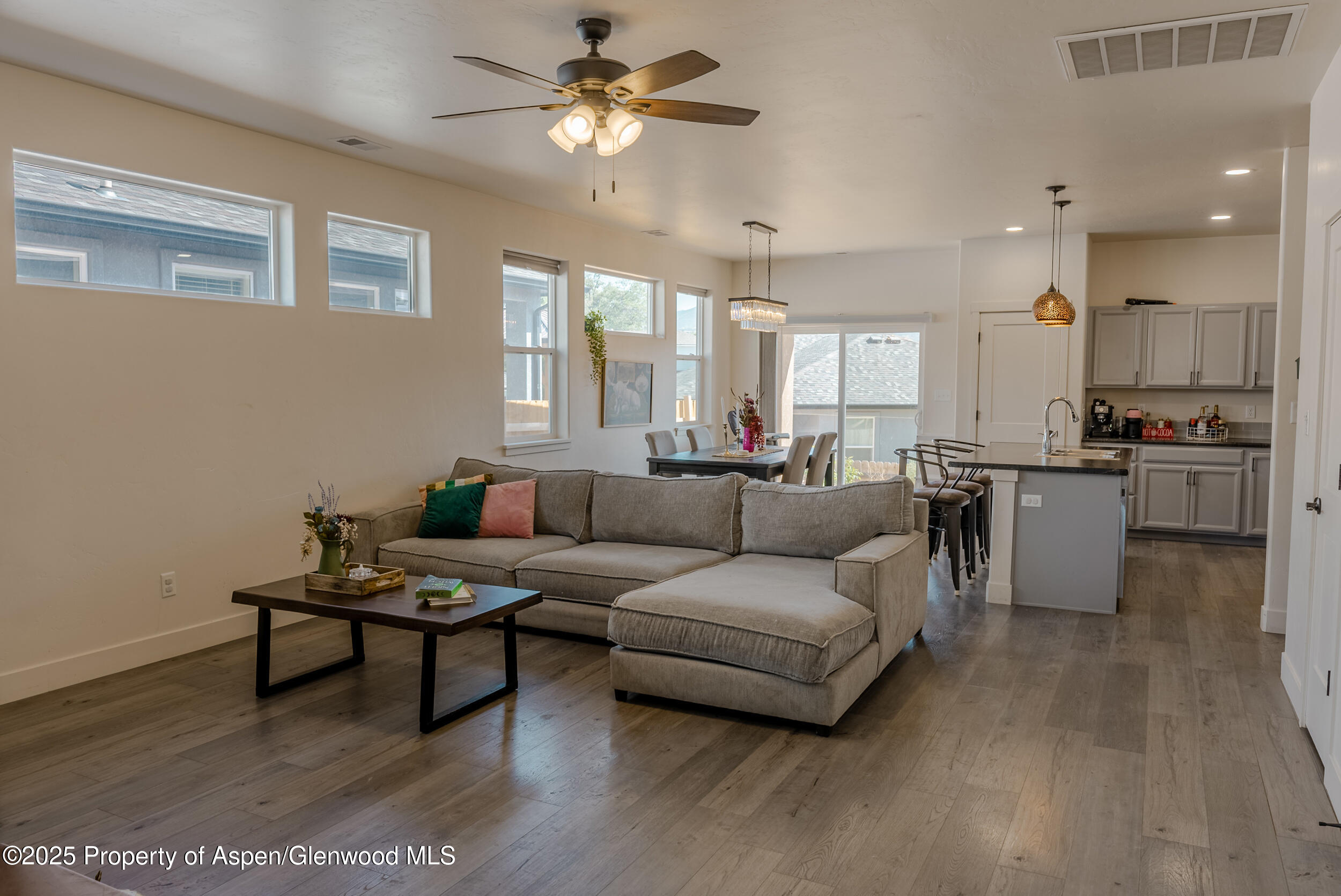 1149 East 17th Street Rifle, CO 81650 - Photo 2 of 16 a living room with furniture and kitchen view