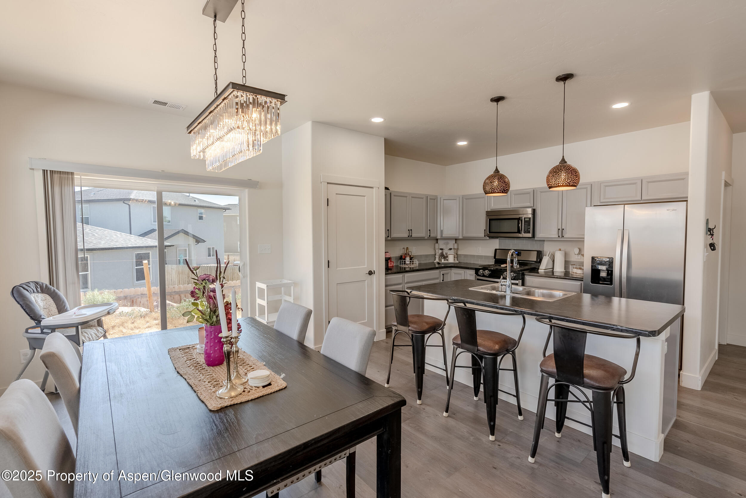1149 East 17th Street Rifle, CO 81650 - Photo 4 of 16 a large kitchen with a table and chairs