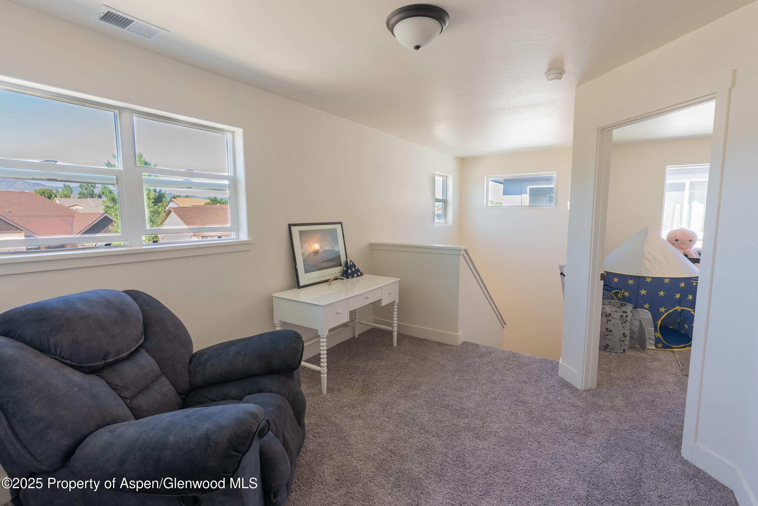 1149 East 17th Street Rifle, CO 81650 - Photo 10 of 16 a living room with furniture and a window