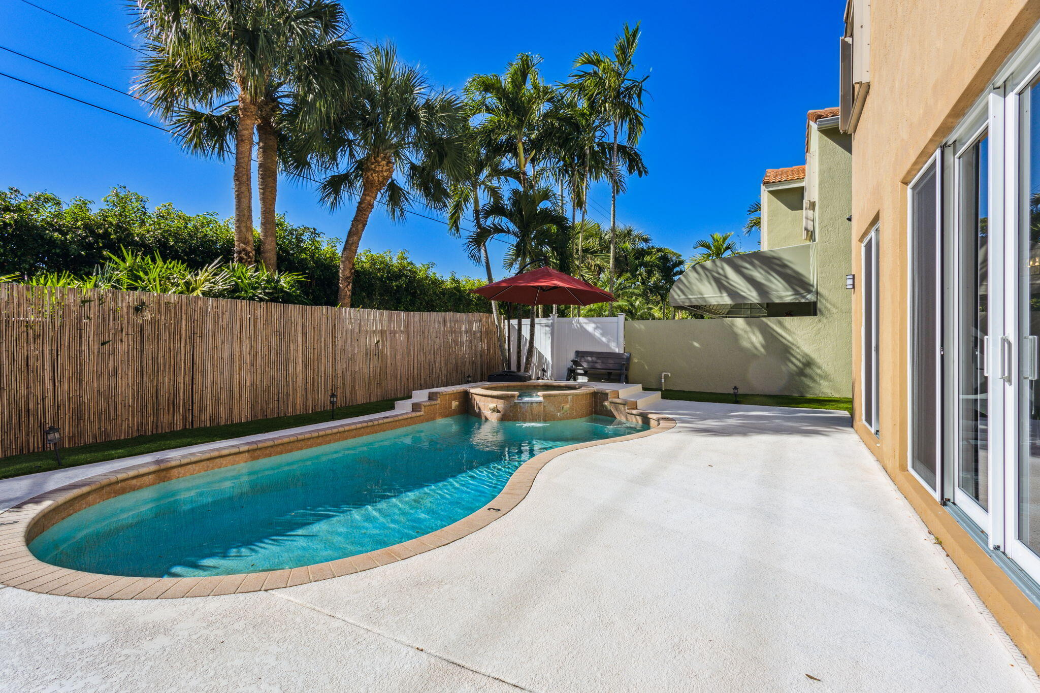 4816 South Classical Boulevard Delray Beach, FL 33445 - Photo 13 of 44 a view of a backyard with a tub