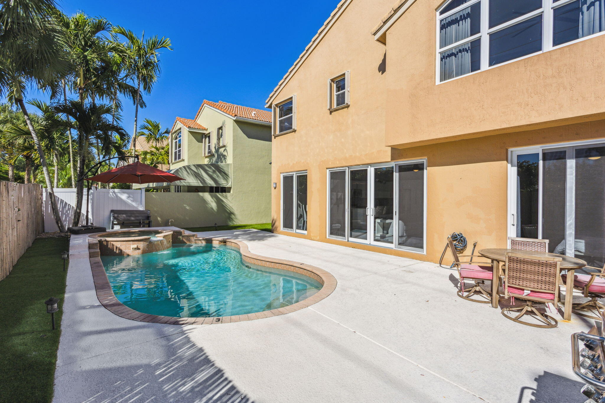 4816 South Classical Boulevard Delray Beach, FL 33445 - Photo 14 of 44 a view of a building with a patio