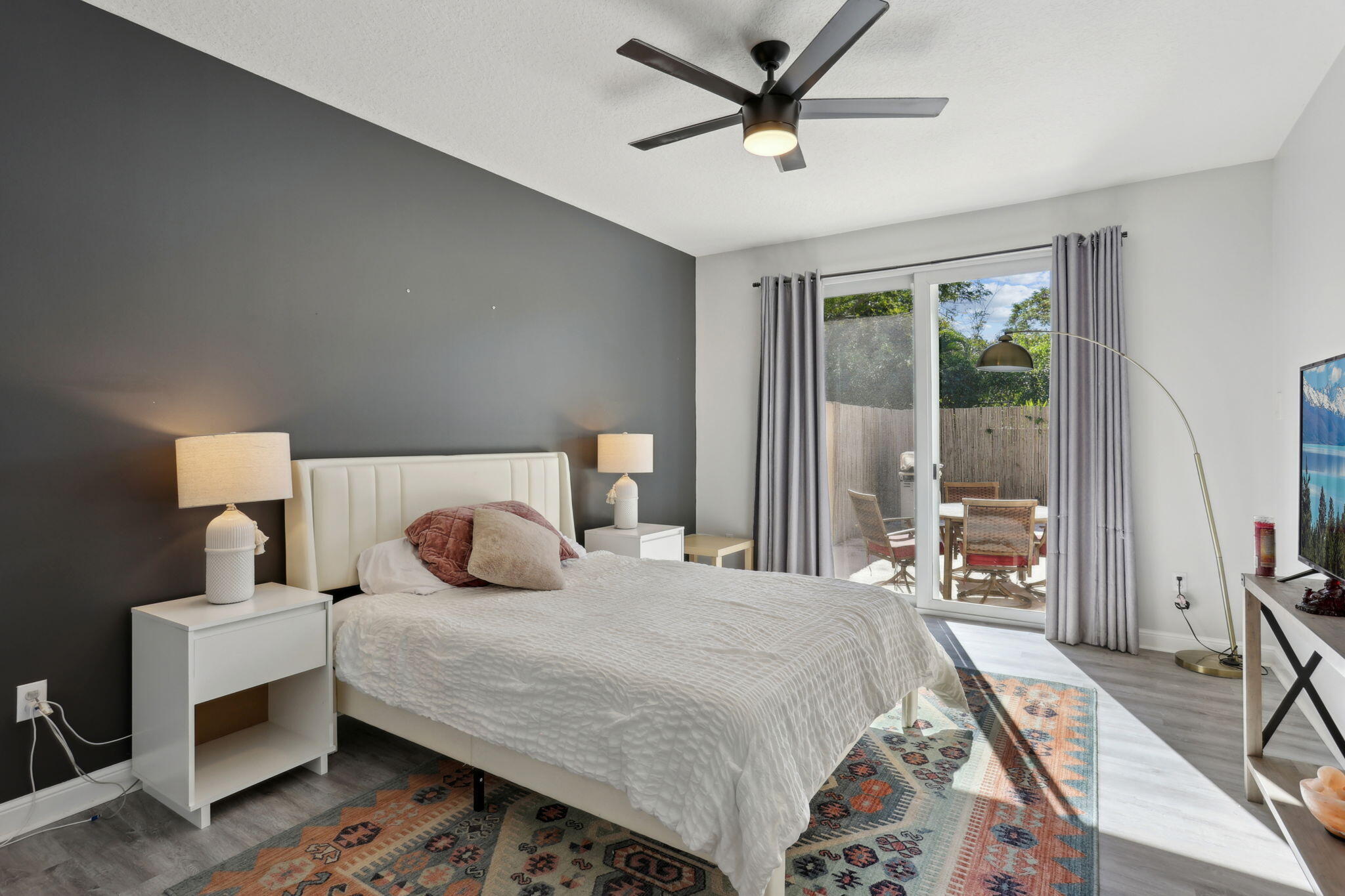 4816 South Classical Boulevard Delray Beach, FL 33445 - Photo 20 of 44 a bedroom with a bed and wooden floor