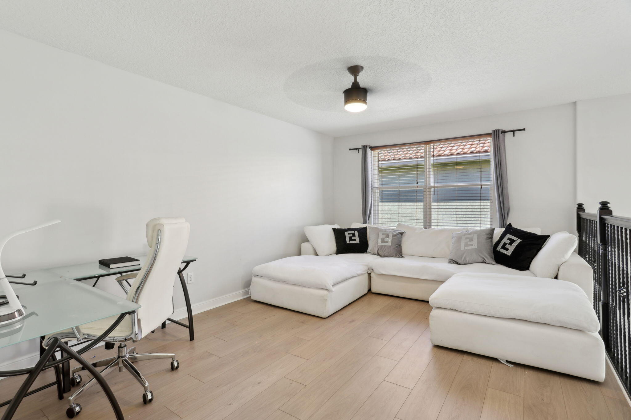 4816 South Classical Boulevard Delray Beach, FL 33445 - Photo 24 of 44 a living room with furniture and a window