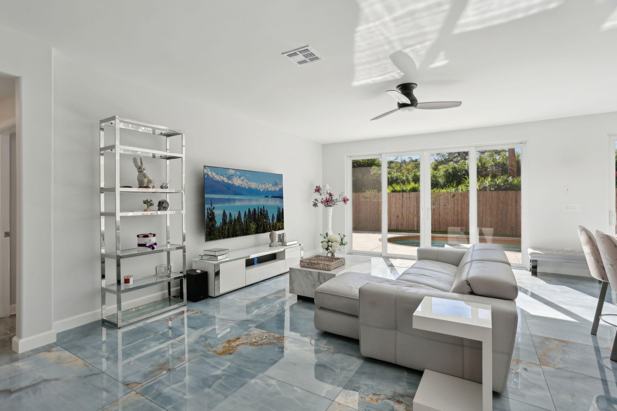 4816 South Classical Boulevard Delray Beach, FL 33445 - Photo 7 of 44 a living room with furniture and a flat screen tv