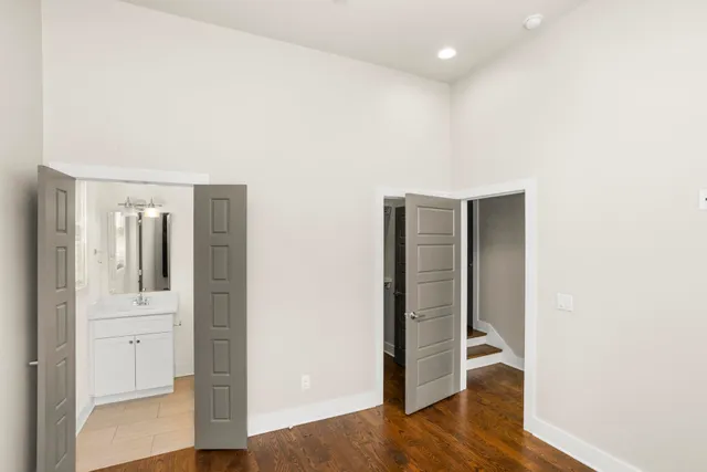 a view of hallway with wooden floor