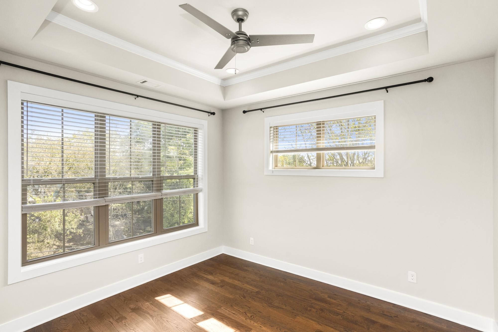 942 Riverside Drive Nashville, TN 37206 - Photo 17 of 33 a view of an empty room with wooden floor and a window