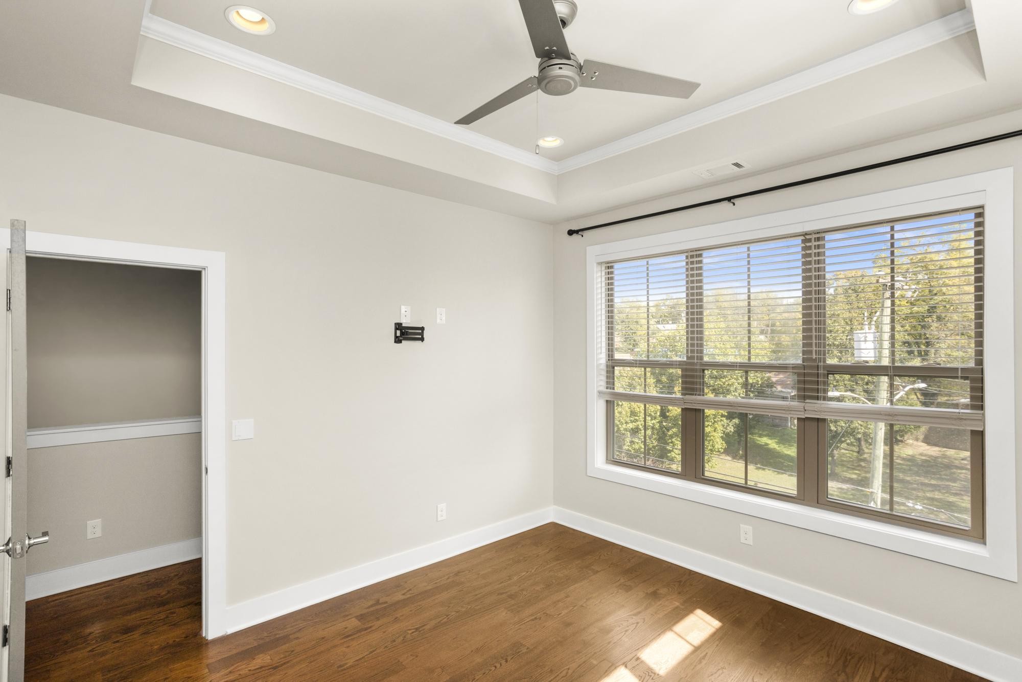 942 Riverside Drive Nashville, TN 37206 - Photo 18 of 33 a view of an empty room with wooden floor and a window