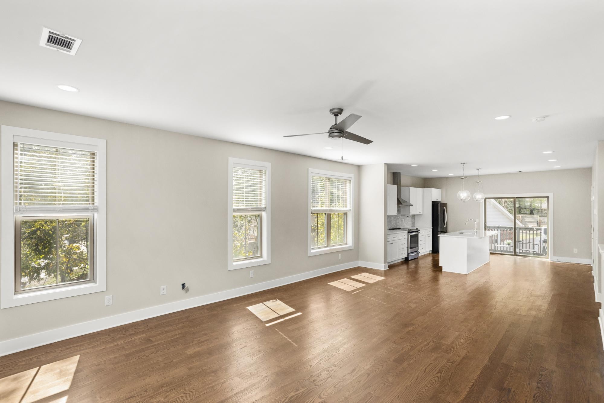 942 Riverside Drive Nashville, TN 37206 - Photo 2 of 33 a view of an empty room with a window and wooden floor