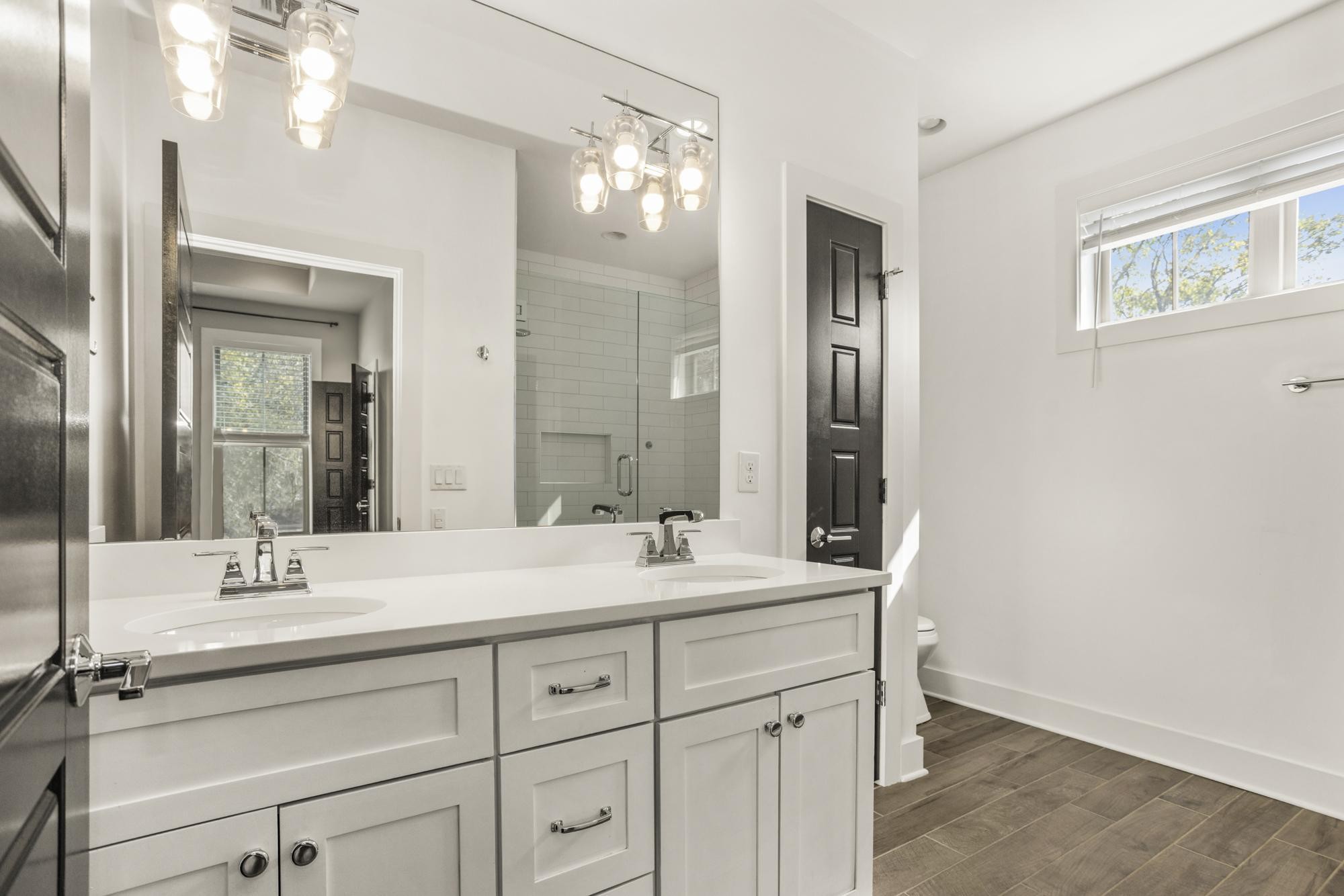 942 Riverside Drive Nashville, TN 37206 - Photo 25 of 33 a bathroom with a double vanity sink mirror and double
