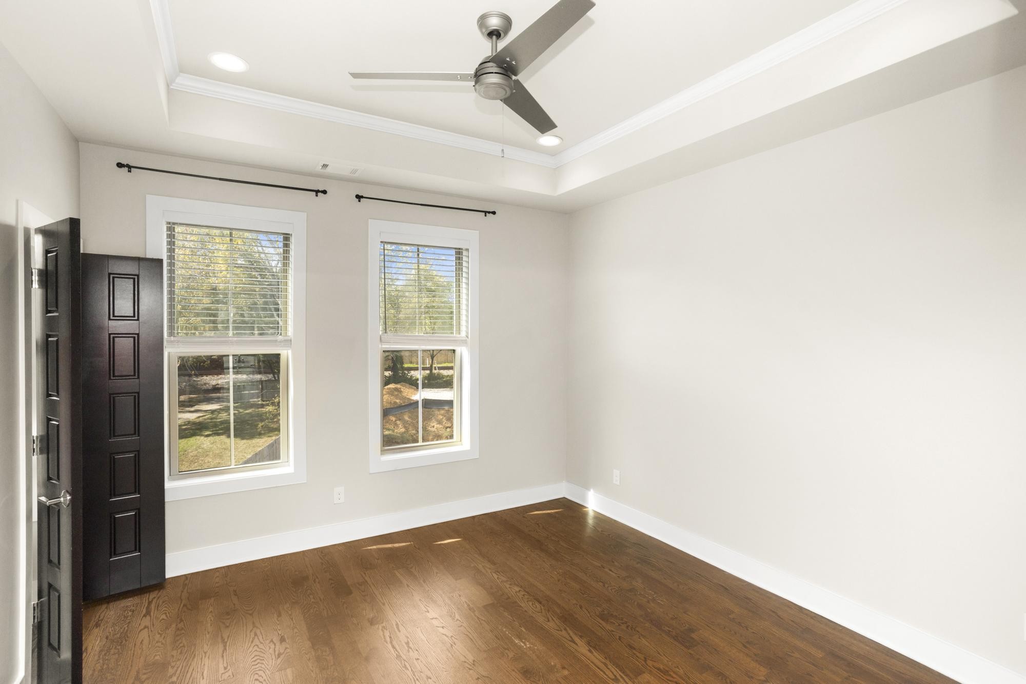 942 Riverside Drive Nashville, TN 37206 - Photo 27 of 33 an empty room with wooden floor and windows