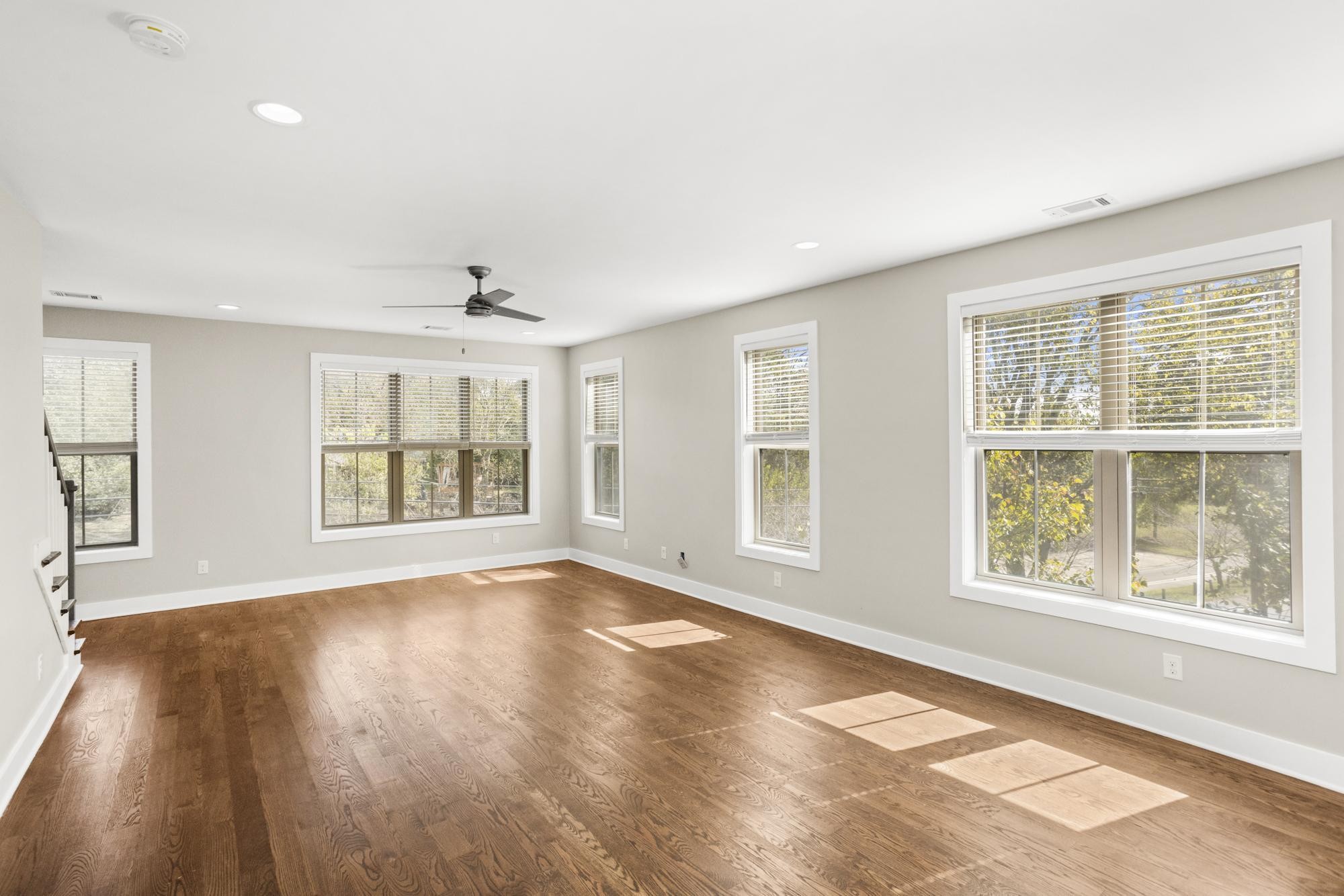 942 Riverside Drive Nashville, TN 37206 - Photo 4 of 33 a view of an empty room with a window and wooden floor