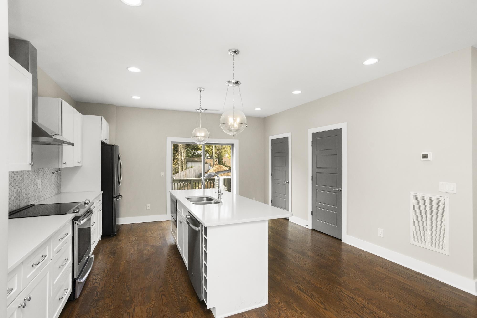 942 Riverside Drive Nashville, TN 37206 - Photo 5 of 33 a large kitchen with a large counter top appliances and cabinets