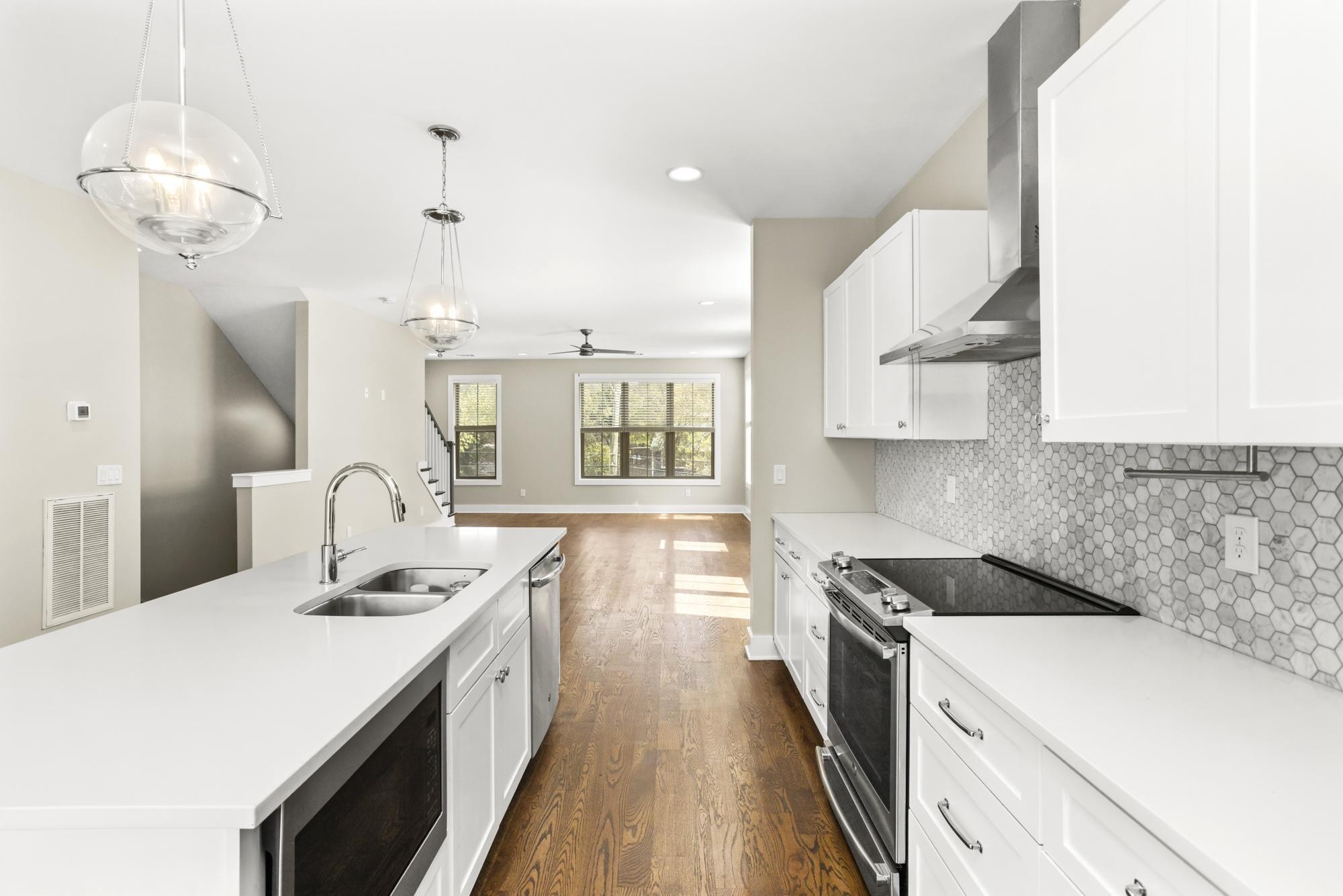942 Riverside Drive Nashville, TN 37206 - Photo 6 of 33 a kitchen that has a lot of cabinets and wooden floor