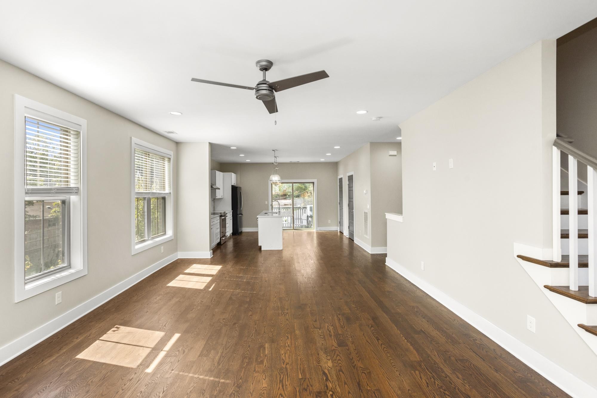 942 Riverside Drive Nashville, TN 37206 - Photo 8 of 33 a view of a big room with wooden floor and windows