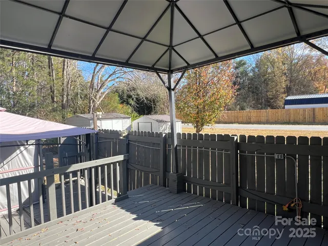 a patio with a table and chairs
