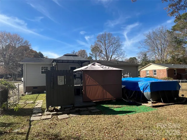 a view of a park with large trees