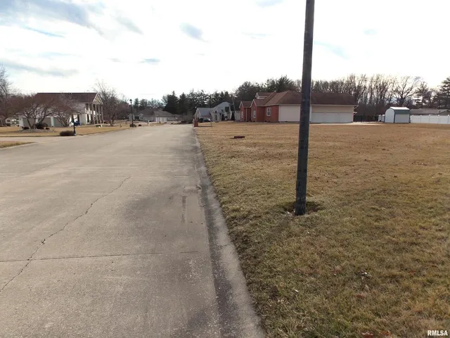 a view of a road with a yard