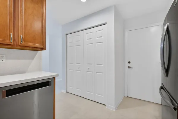 a kitchen with stainless steel appliances a refrigerator stove microwave and sink