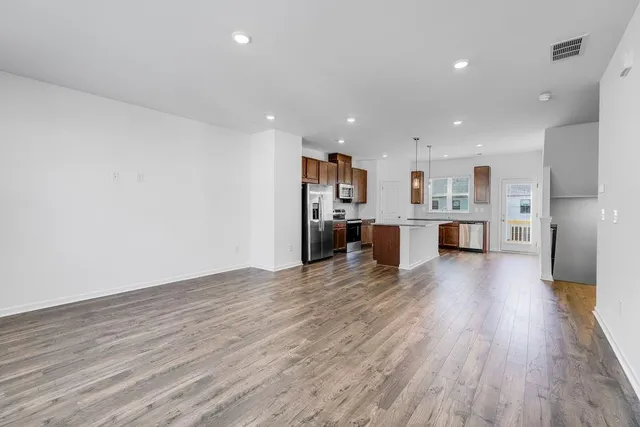 a view of kitchen with wooden floor