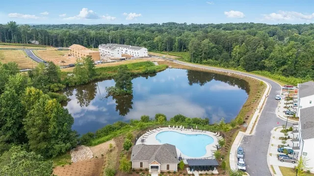 a view of a house with a yard and plants