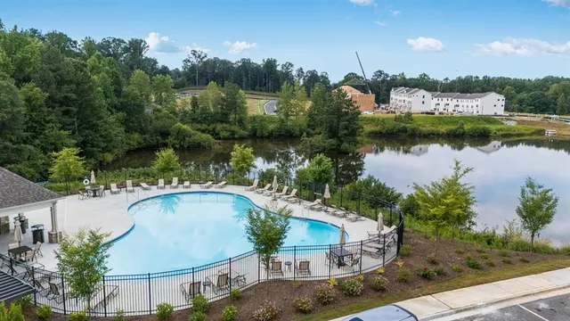 a white and blue umbrella sitting on a beach