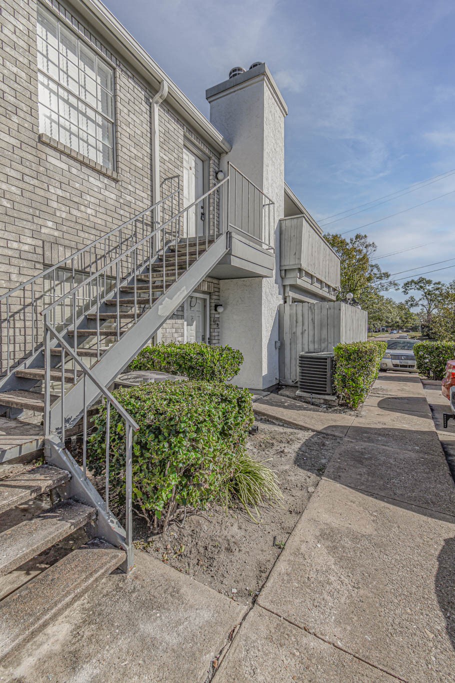 8787 Brae Acres Road, Unit 814 Houston, TX 77074 - Photo 12 of 23 a front view of a house with a yard