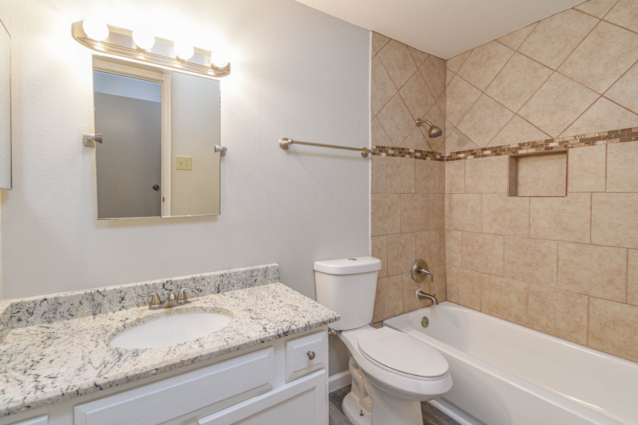 8787 Brae Acres Road, Unit 814 Houston, TX 77074 - Photo 17 of 23 a bathroom with a granite countertop sink toilet and shower