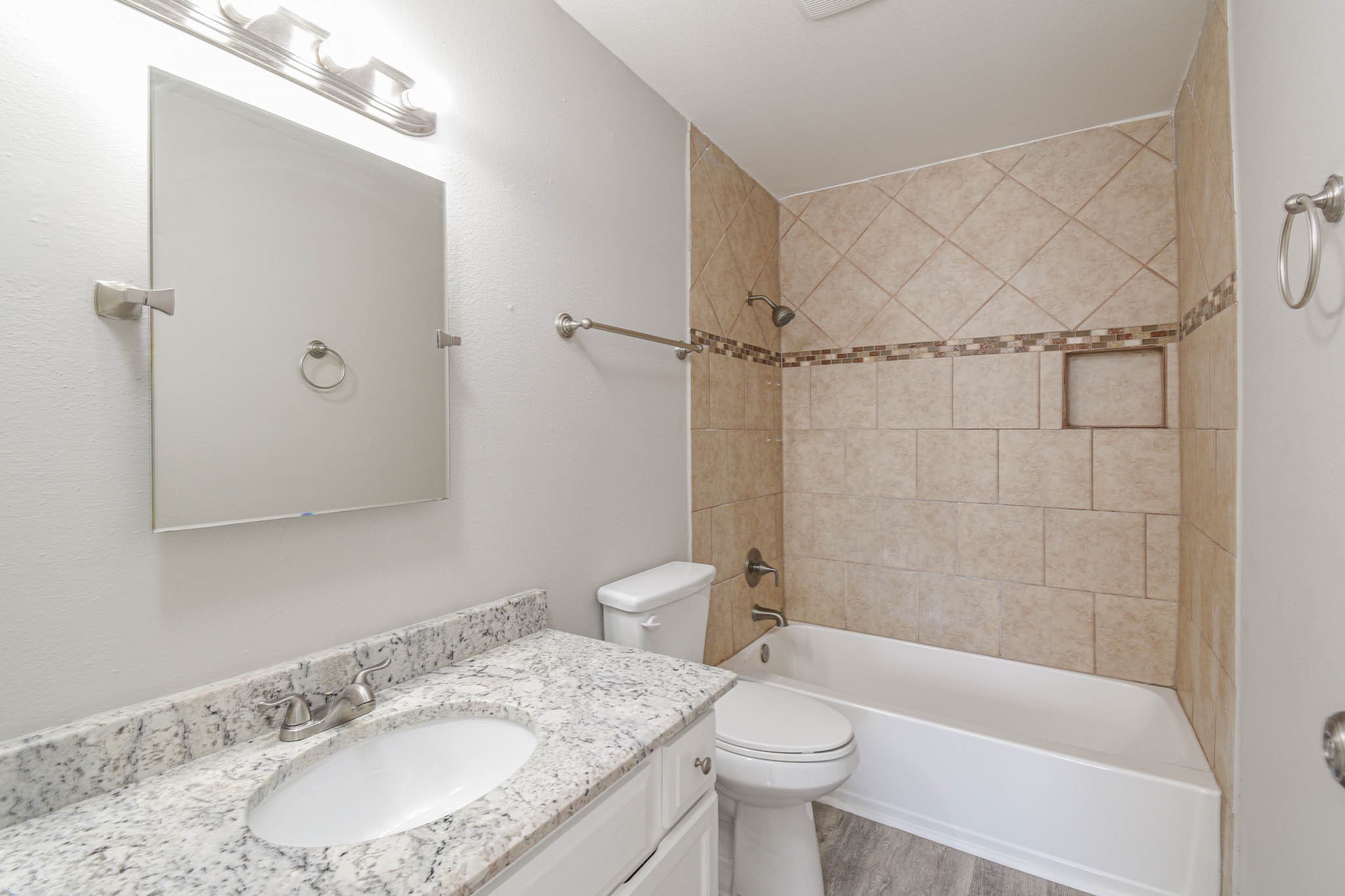 8787 Brae Acres Road, Unit 814 Houston, TX 77074 - Photo 18 of 23 a bathroom with a granite countertop sink toilet and shower