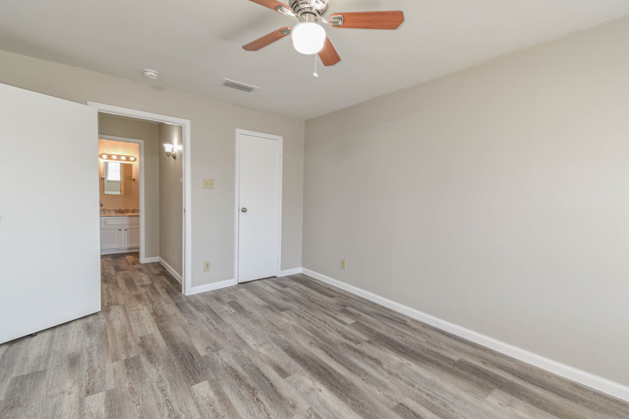 8787 Brae Acres Road, Unit 814 Houston, TX 77074 - Photo 20 of 23 wooden floor in an empty room with a window