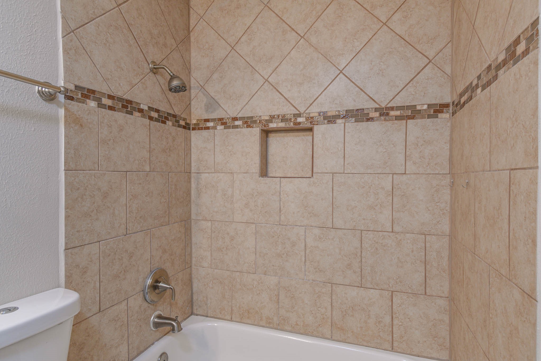 8787 Brae Acres Road, Unit 814 Houston, TX 77074 - Photo 22 of 23 a bathroom with a toilet and a shower